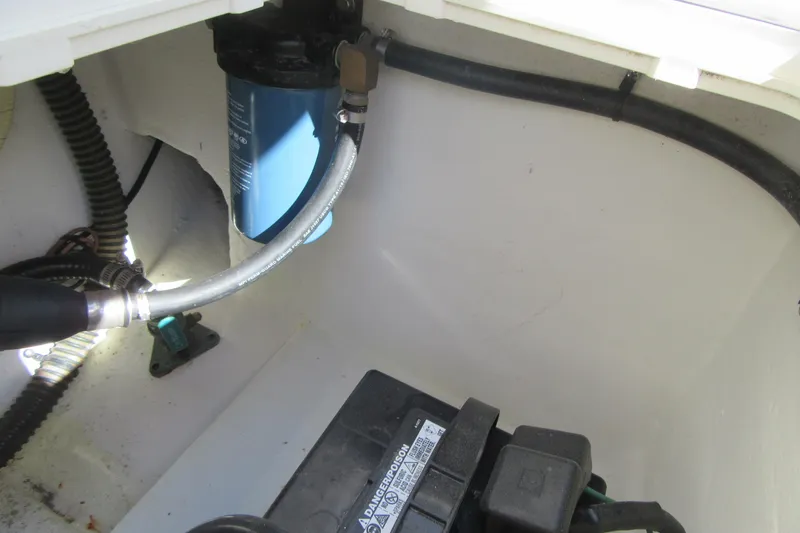 Slide: The Image of 2013 Parker 2320 SL Sport Cabin engine compartment with filter and wiring. - 23