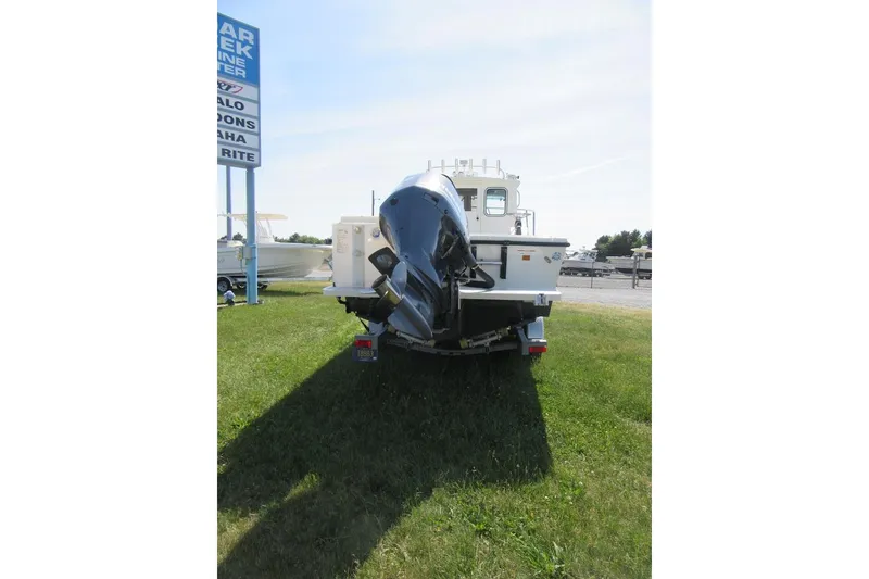Slide: The Image of 2013 Parker 2320 SL Sport Cabin boat on trailer, rear view, outdoor display. - 3