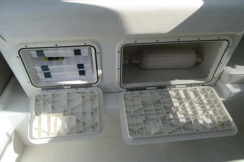 Slide: The Image of Storage compartments on a 2013 Parker 2320 SL Sport Cabin boat. - 33