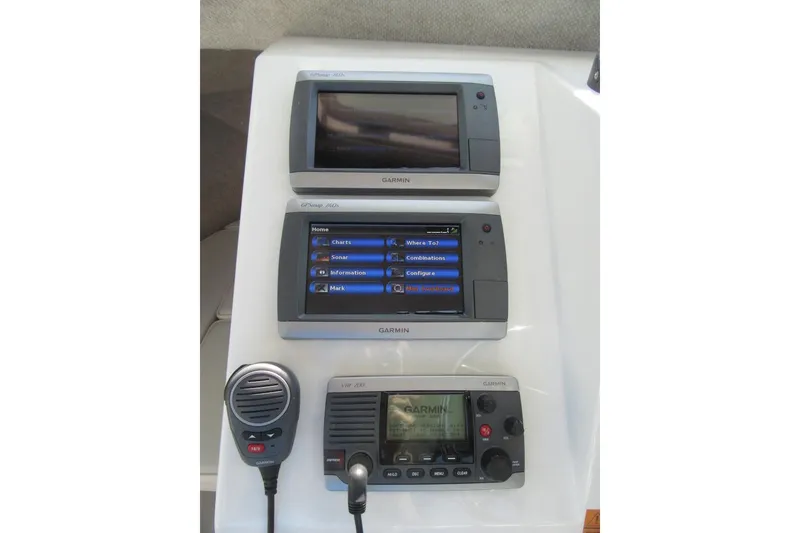 Slide: The Image of Garmin marine electronics on a 2013 Parker 2320 SL Sport Cabin boat dashboard. - 36