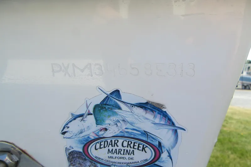 Slide: The Image of Hull identification number on 2013 Parker 2320 SL Sport Cabin boat with Cedar Creek Marina sticker. - 4