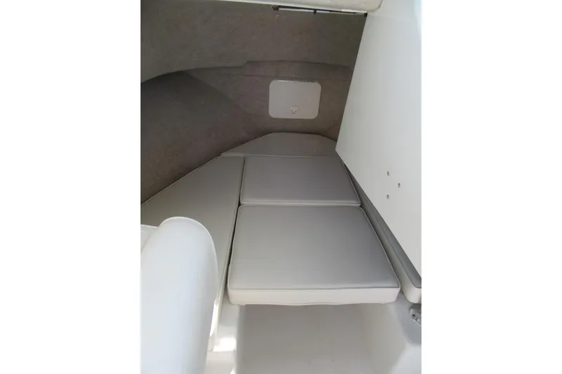 Slide: The Image of Interior cabin of 2013 Parker 2320 SL Sport Cabin boat with cushioned seating. - 42