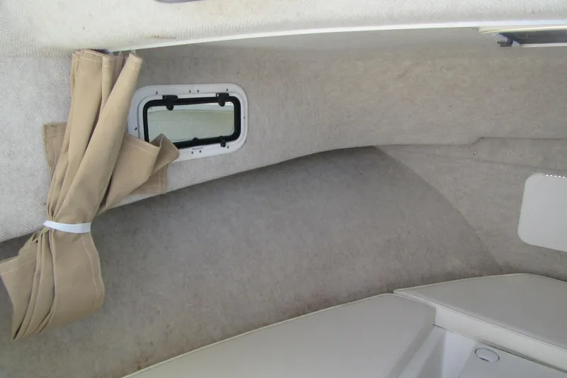 Slide: The Image of Interior cabin of 2013 Parker 2320 SL Sport Cabin boat with window and curtain. - 44