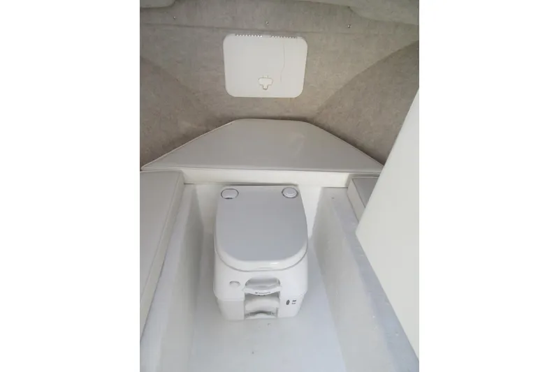 Slide: The Image of Compact marine toilet in 2013 Parker 2320 SL Sport Cabin boat interior. - 46