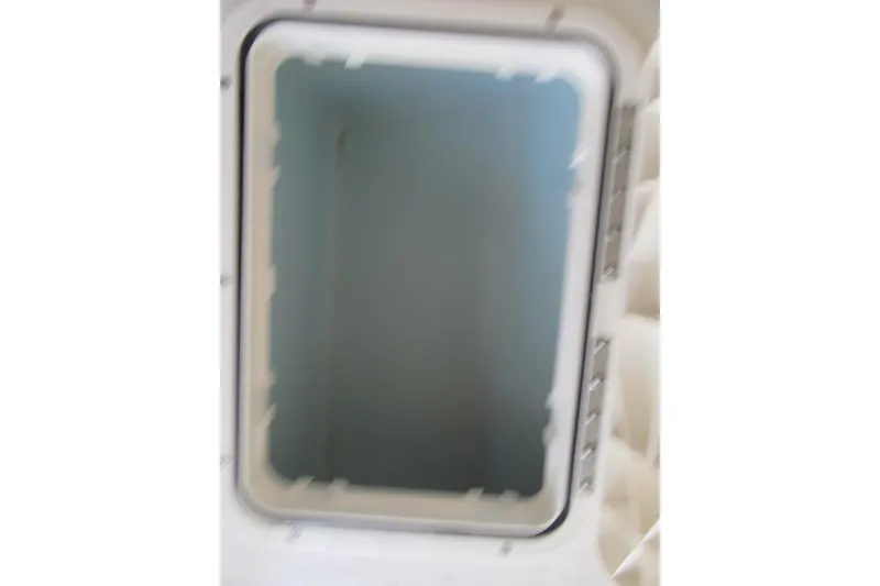 Slide: The Image of Open storage compartment in 2013 Parker 2320 SL Sport Cabin boat. - 48