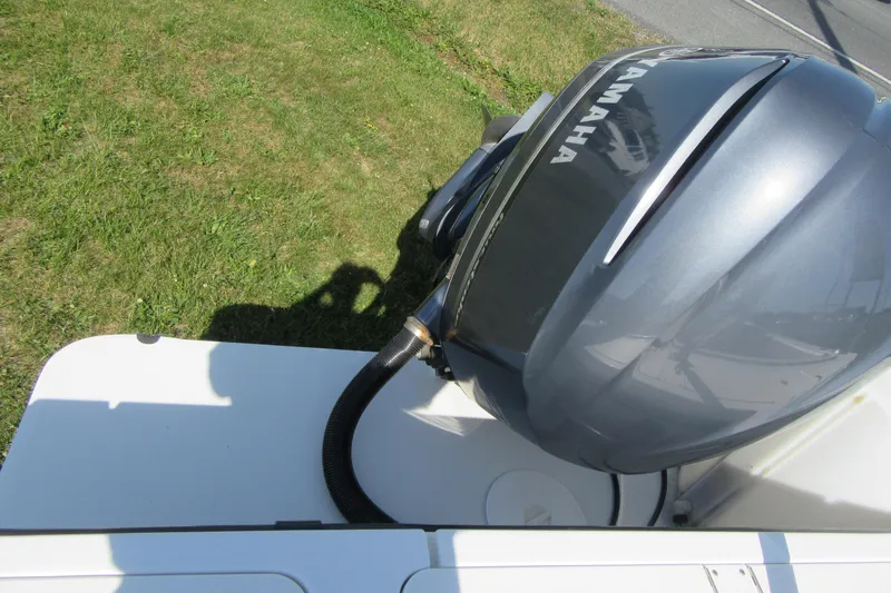 Slide: The Image of Yamaha outboard motor on 2013 Parker 2320 SL Sport Cabin boat, grassy background. - 7