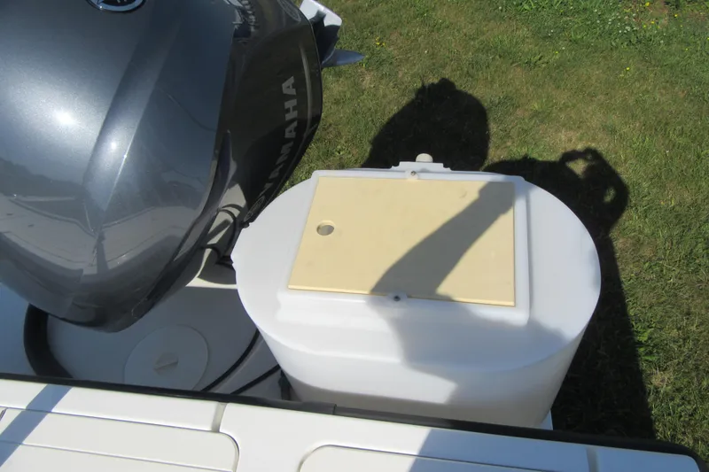 Slide: The Image of Yamaha outboard motor on 2013 Parker 2320 SL Sport Cabin boat, grass background. - 8