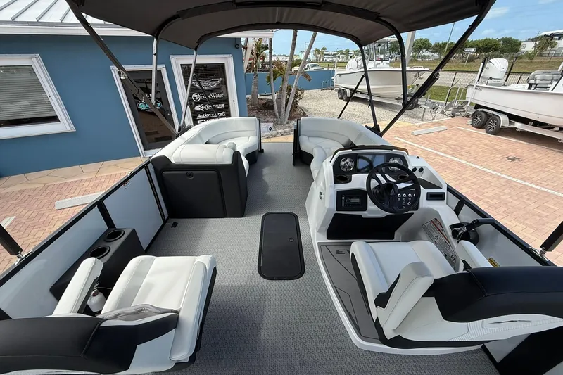Slide: The Image of Interior of 2026 Evotti 523CS boat with modern seating and steering console. - 10
