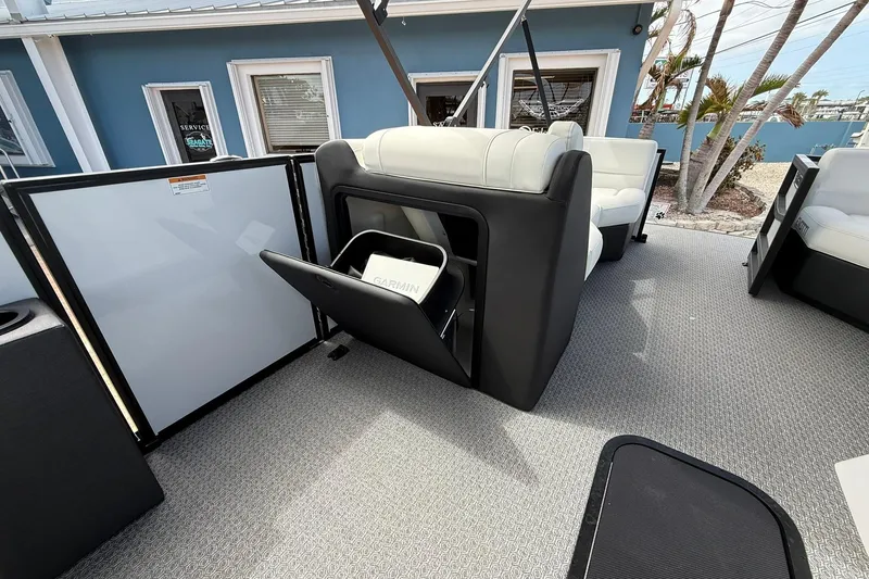 Slide: The Image of 2026 Evotti 523CS boat interior with storage compartment open, showcasing modern seating design. - 13