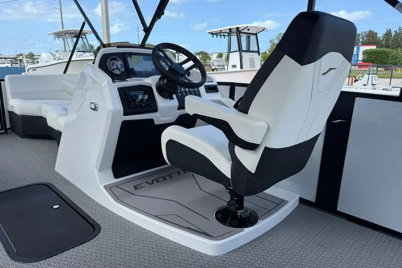 Slide: The Image of 2026 Evotti 523CS boat interior with modern steering console and comfortable seating. - 18