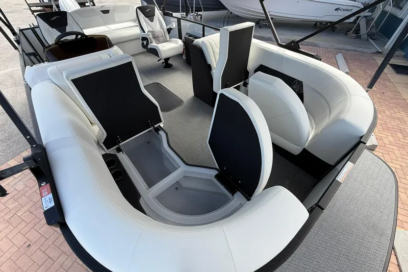 Slide: The Image of Luxurious 2026 Evotti 523CS boat interior with plush white seating and storage compartments. - 21