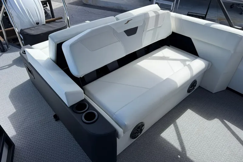 Slide: The Image of Luxurious white seating on 2026 Evotti 523CS boat, featuring cup holders and integrated speakers. - 25