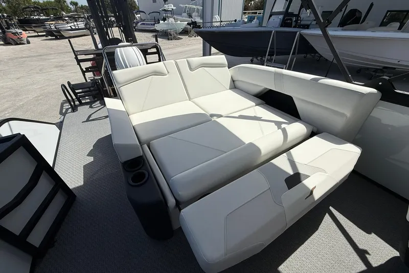 Slide: The Image of Luxurious seating on 2026 Evotti 523CS boat, featuring sleek white upholstery and cup holders. - 27