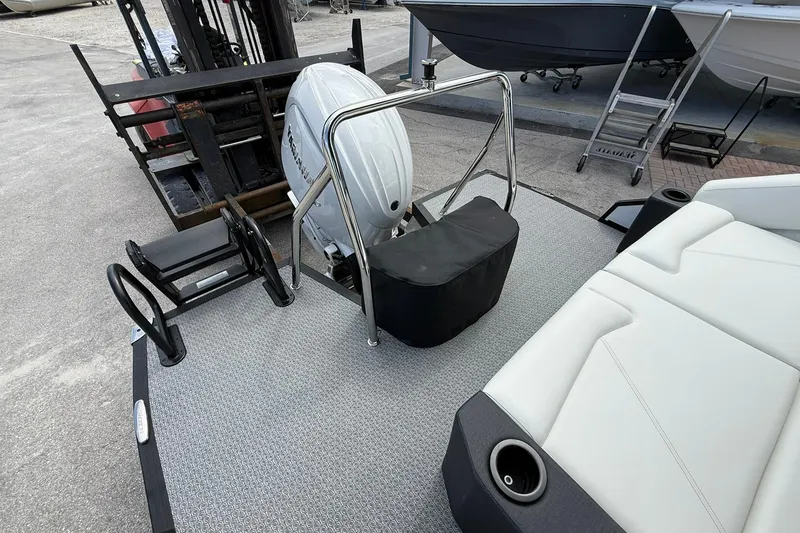 Slide: The Image of Rear view of 2026 Evotti 523CS boat with motor and seating area. - 6