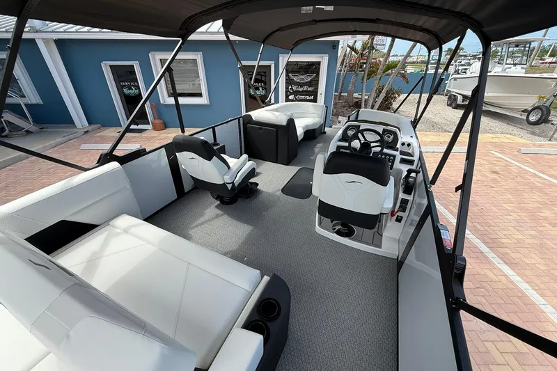 Slide: The Image of Interior of 2026 Evotti 523CS boat with modern seating and steering console. - 8