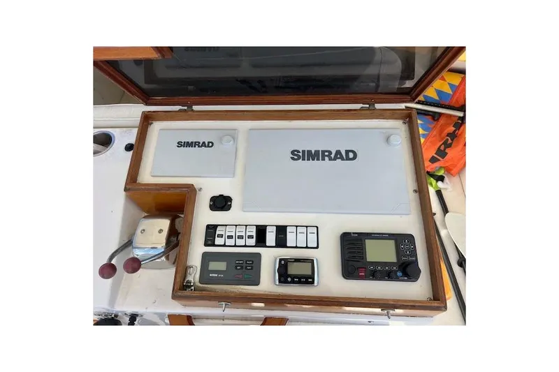 Slide: The Image of Control panel of a 1985 Egg Harbor 33 Convertible boat with Simrad equipment. - 11