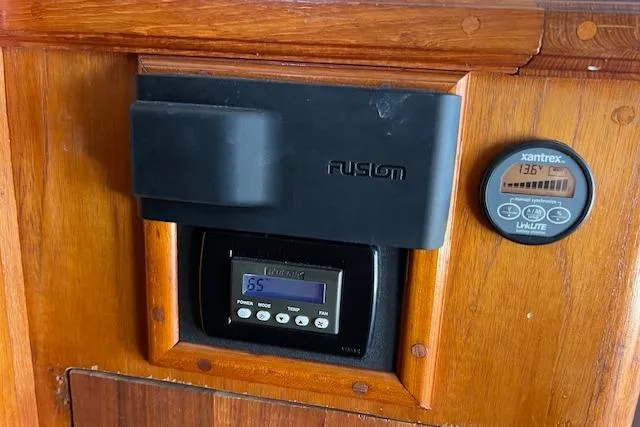 Slide: The Image of Control panel on 1985 Egg Harbor 33 Convertible boat with Fusion and Xantrex displays. - 23