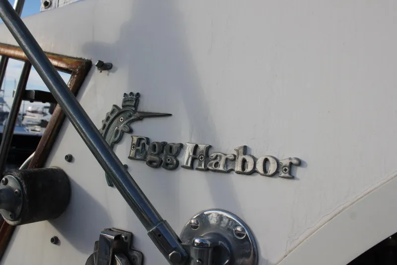 Slide: The Image of 1985 Egg Harbor 33 Convertible boat emblem and hardware detail. - 31