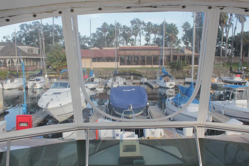 Slide: The Image of View from 1985 Egg Harbor 33 Convertible overlooking marina with various docked boats. - 34