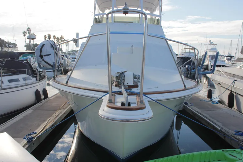 Slide: The Image of 1985 Egg Harbor 33 Convertible yacht docked at marina, front view. - 6