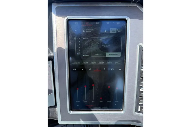 Slide: The Image of Touchscreen control panel of a 2022 MasterCraft XT24 boat displaying surf settings. - 15