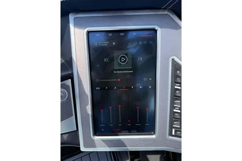 Slide: The Image of Touchscreen control panel of a 2022 MasterCraft XT24 boat, displaying audio settings. - 16