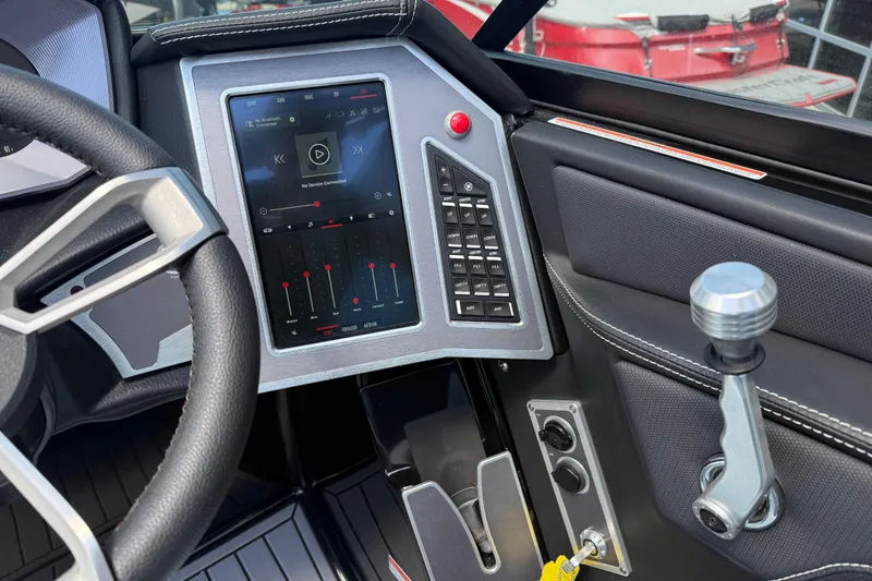 Slide: The Image of 2022 MasterCraft XT24 dashboard with touchscreen controls and steering wheel. - 17