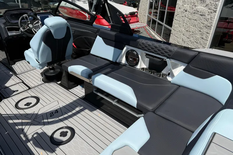 Slide: The Image of Interior of 2022 MasterCraft XT24 boat with sleek seating and modern design. - 23