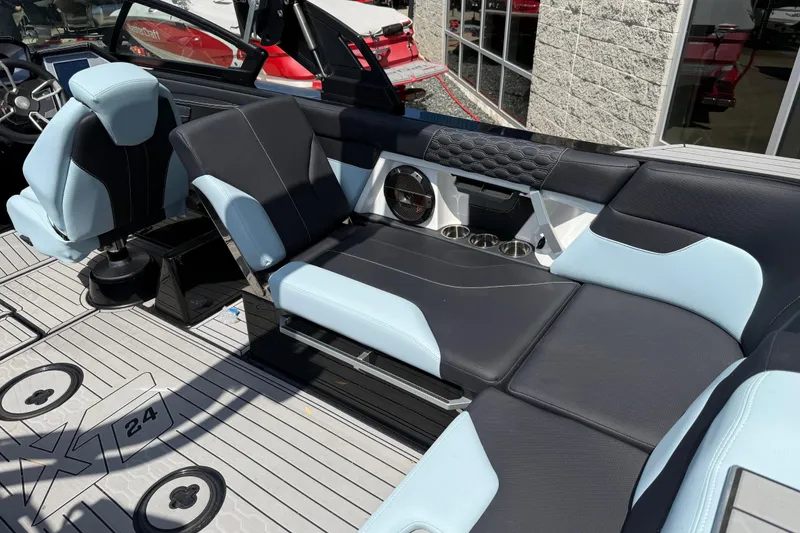 Slide: The Image of 2022 MasterCraft XT24 boat interior with sleek seating and modern design. - 24