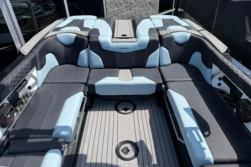 Slide: The Image of Luxurious interior of 2022 MasterCraft XT24 boat with stylish seating and cup holders. - 25
