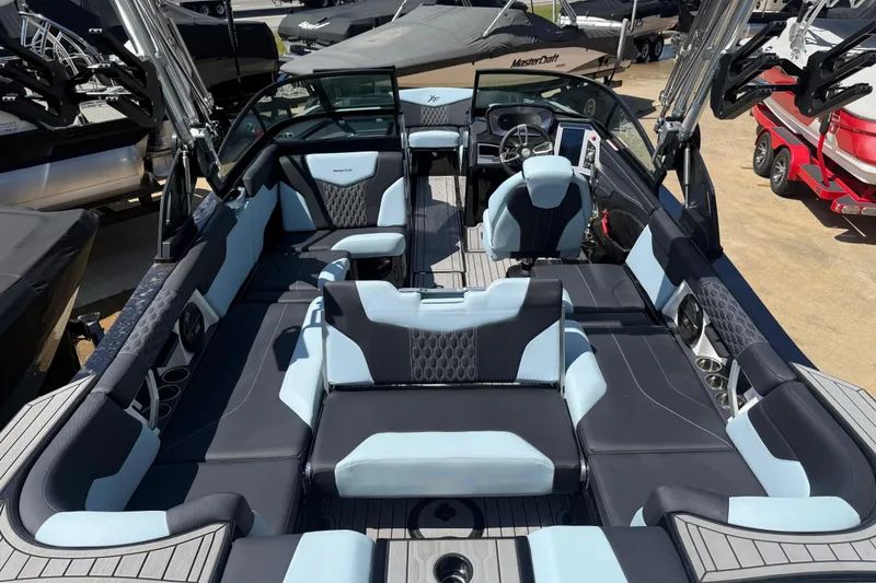 Slide: The Image of 2022 MasterCraft XT24 boat interior with luxurious seating and modern design. - 29