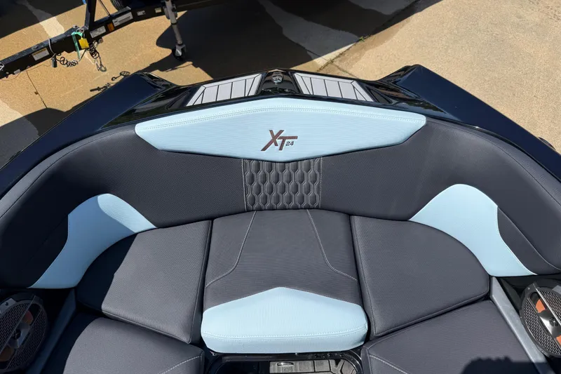 Slide: The Image of 2022 MasterCraft XT24 boat interior with stylish blue and gray seating. - 3