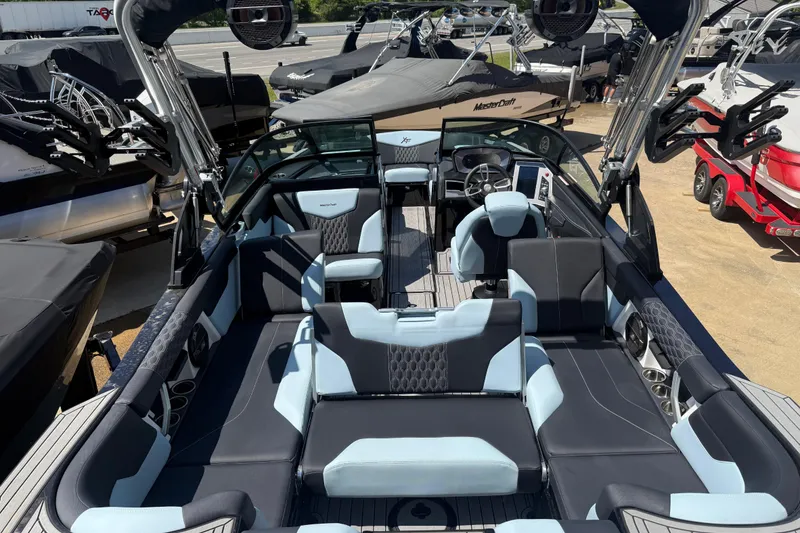 Slide: The Image of 2022 MasterCraft XT24 boat interior with sleek seating and modern design. - 30
