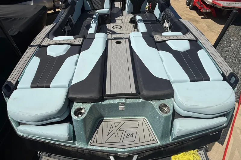 Slide: The Image of 2022 MasterCraft XT24 boat interior with sleek seating and modern design. - 31