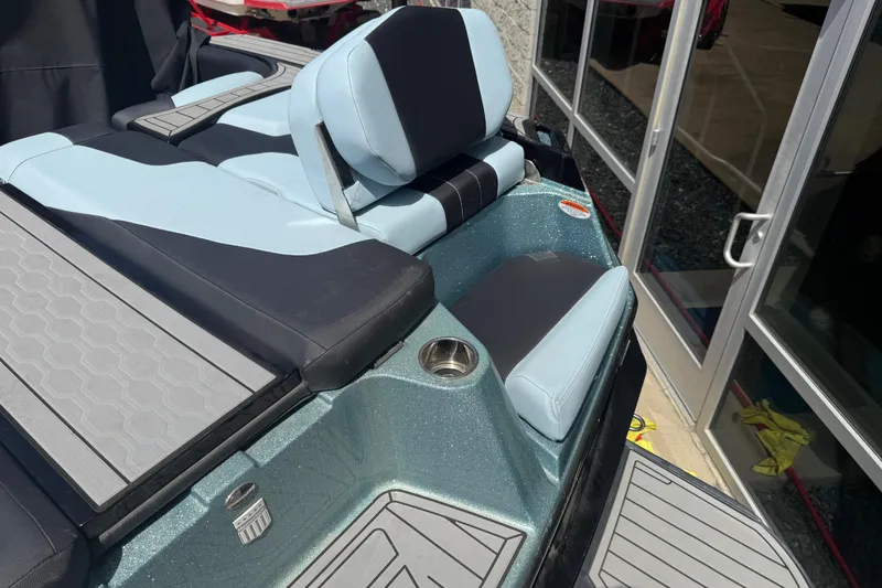 Slide: The Image of 2022 MasterCraft XT24 boat interior with sleek seating and modern design. - 32