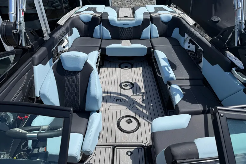 Slide: The Image of 2022 MasterCraft XT24 boat interior with luxurious seating and modern design. - 6