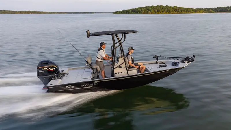 Slide: The Image of G3 Bay 19 GX boat 2026 on calm water. - 14