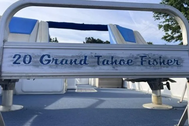 Slide: The Image of 1995 Playbuoy 20 Grand Tahoe Fisher boat with blue seating and deck. - 15