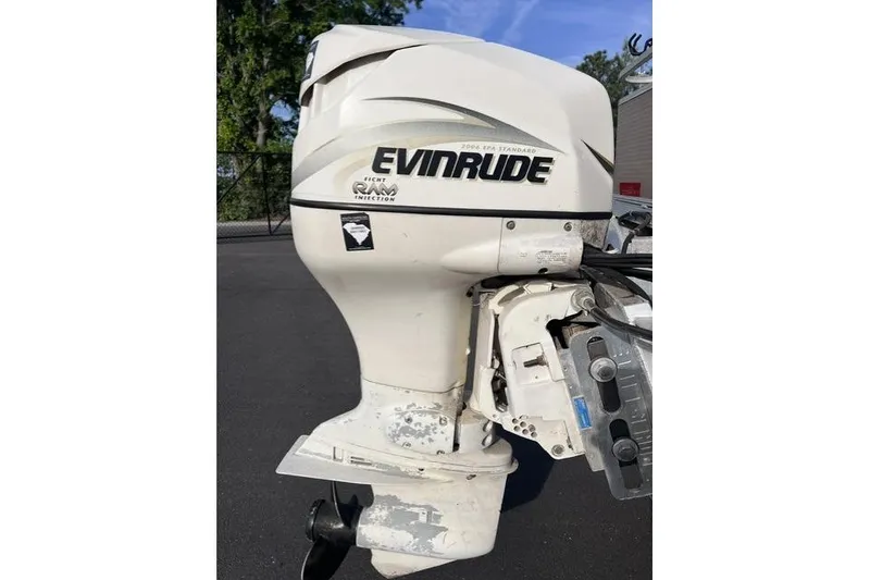 Slide: The Image of Evinrude outboard motor on a 1995 Playbuoy 20 Grand Tahoe Fisher boat. - 17