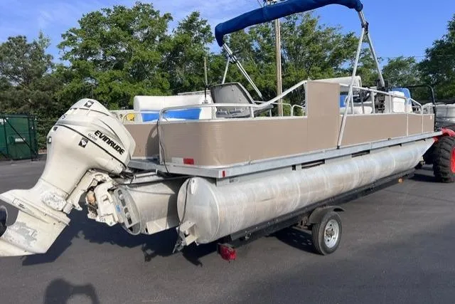 Slide: The Image of 1995 Playbuoy 20 Grand Tahoe Fisher pontoon boat with Evinrude motor on trailer. - 4