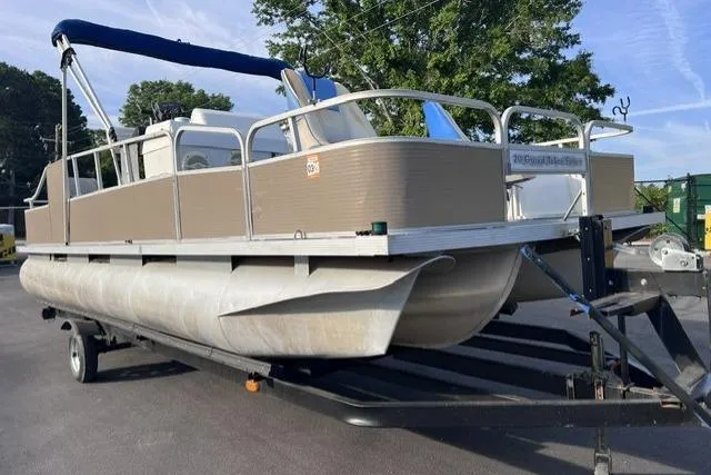 Slide: The Image of 1995 Playbuoy 20 Grand Tahoe Fisher pontoon boat on trailer, parked outdoors. - 5