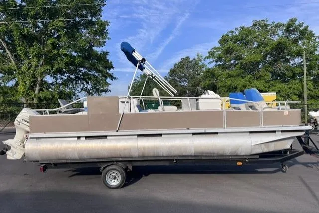 Slide: The Image of 1995 Playbuoy 20 Grand Tahoe Fisher pontoon boat on trailer, parked outdoors. - 6