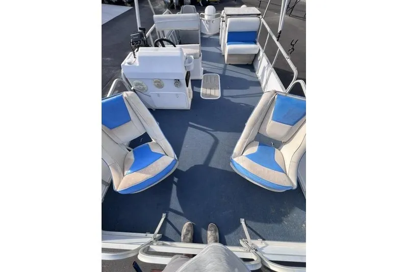 Slide: The Image of 1995 Playbuoy 20 Grand Tahoe Fisher pontoon boat interior with blue and white seating. - 8