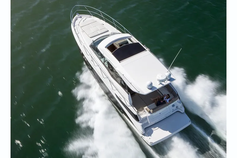 Slide: The Image of Cockpit of 2019 Regal 42 Grande Coupe with modern navigation controls and steering wheel. - 14