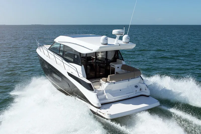 Slide: The Image of Cockpit of 2019 Regal 42 Grande Coupe with Garmin displays and controls. - 15