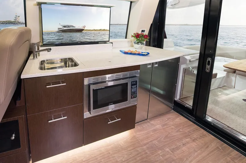 Slide: The Image of Interior view of 2019 Regal 42 Grande Coupe yacht at a marina. - 23