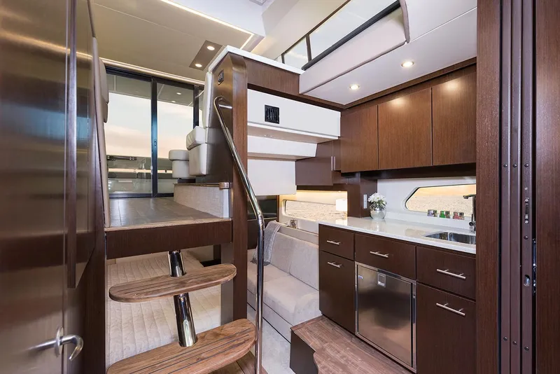 Slide: The Image of Luxurious bedroom interior of 2019 Regal 42 Grande Coupe yacht with cozy bedding. - 26