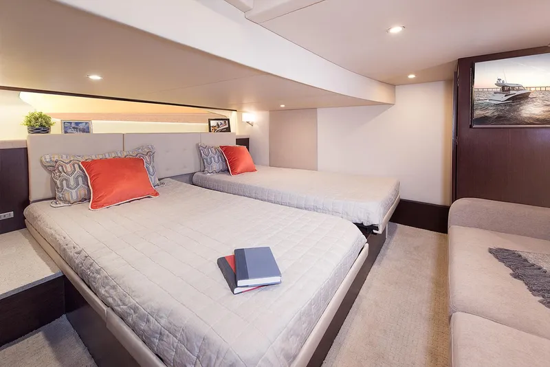Slide: The Image of Interior cabin of 2019 Regal 42 Grande Coupe with bed and storage. - 28
