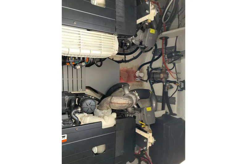 Slide: The Image of Engine room of a 2019 Regal 42 Grande Coupe boat, showcasing mechanical components. - 34