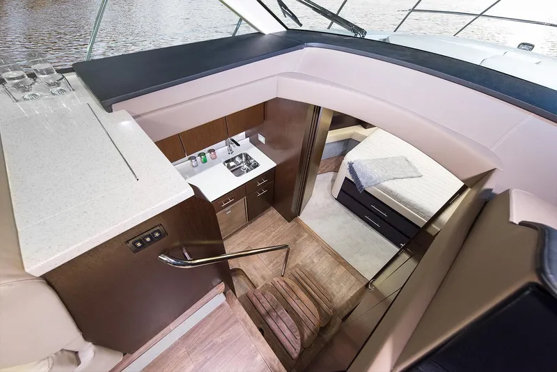 Slide: The Image of Manufacturer Provided Image: Interior of 2019 Regal 42 Grande Coupe yacht with kitchen and bedroom. - 56